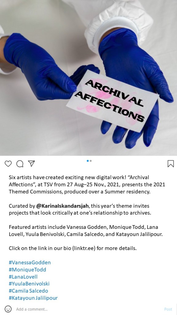 An Instagram post with black text against a white background and an image of two hands in blue gloves holding a white piece of paper bearing the words Archival Affections.